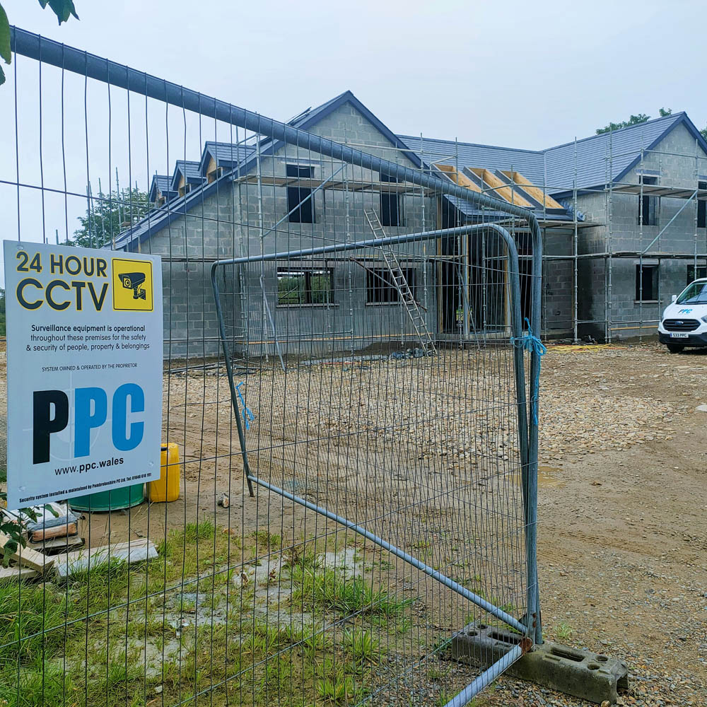 CCTV installed at a construction site with warning signs